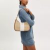Teri Hobo-väska i Signature Canvas med rand