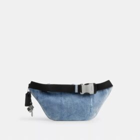 Travis bältesväska 35 i sliten denim med smycken