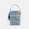 Tristan crossbody-väska 14 i den populära signaturdenimen med smycken