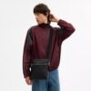 Tristan crossbody-väska 22 i signaturläder