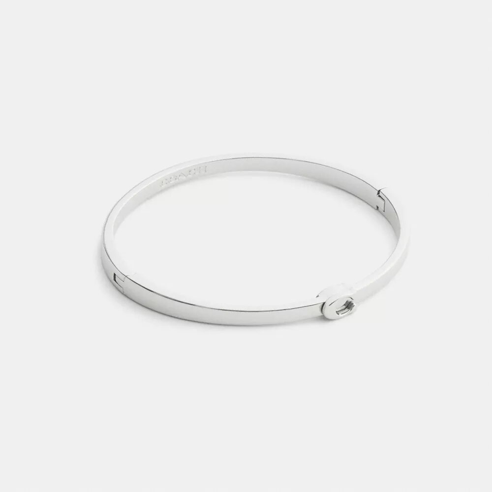 Tunt armband med vår signatur och gångjärn