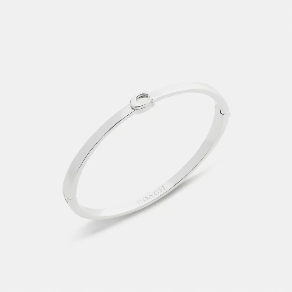 Tunt armband med vår signatur och gångjärn
