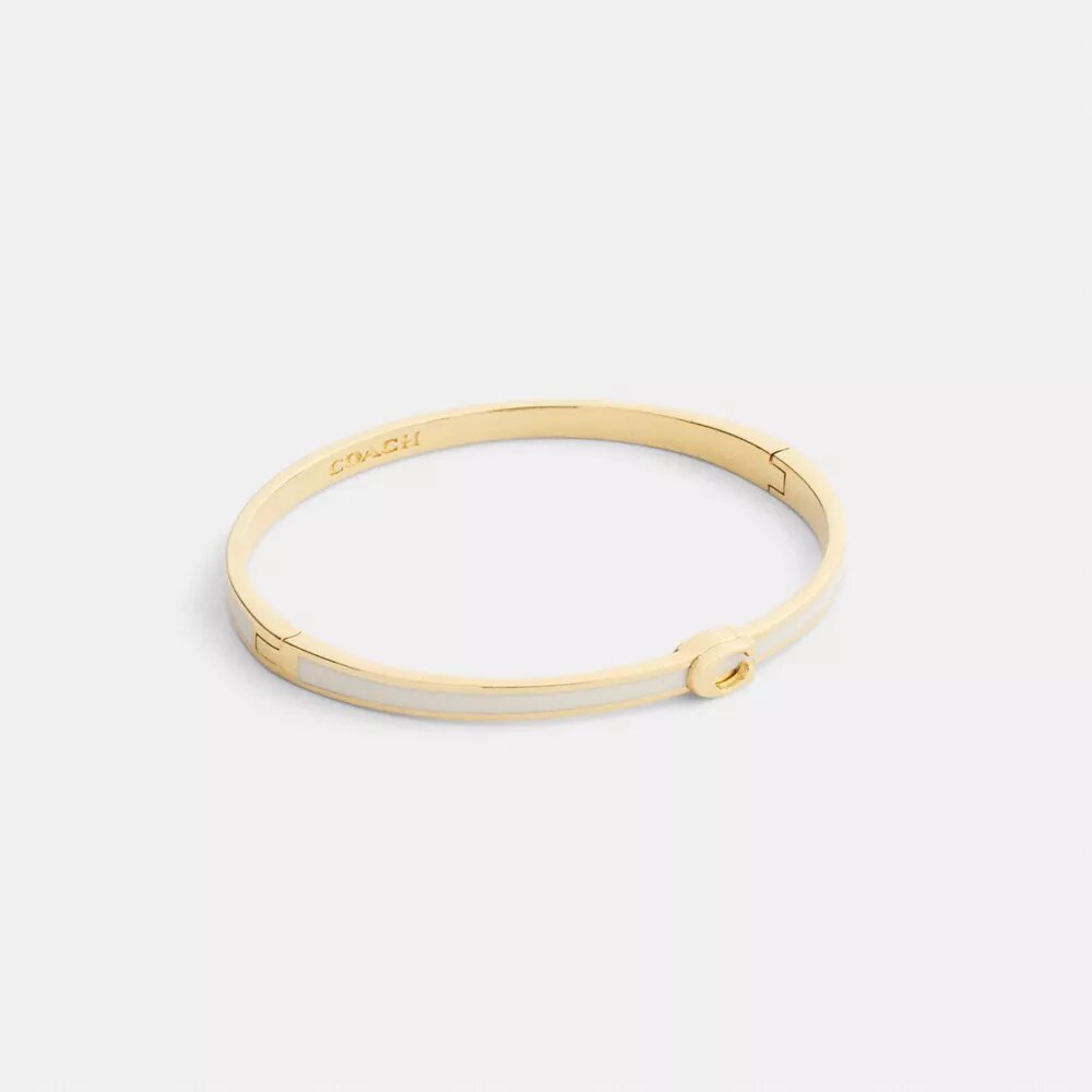 Tunt emaljerat armband med vår signatur och gångjärn