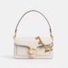 Väsksmycke med kristallmotiv
